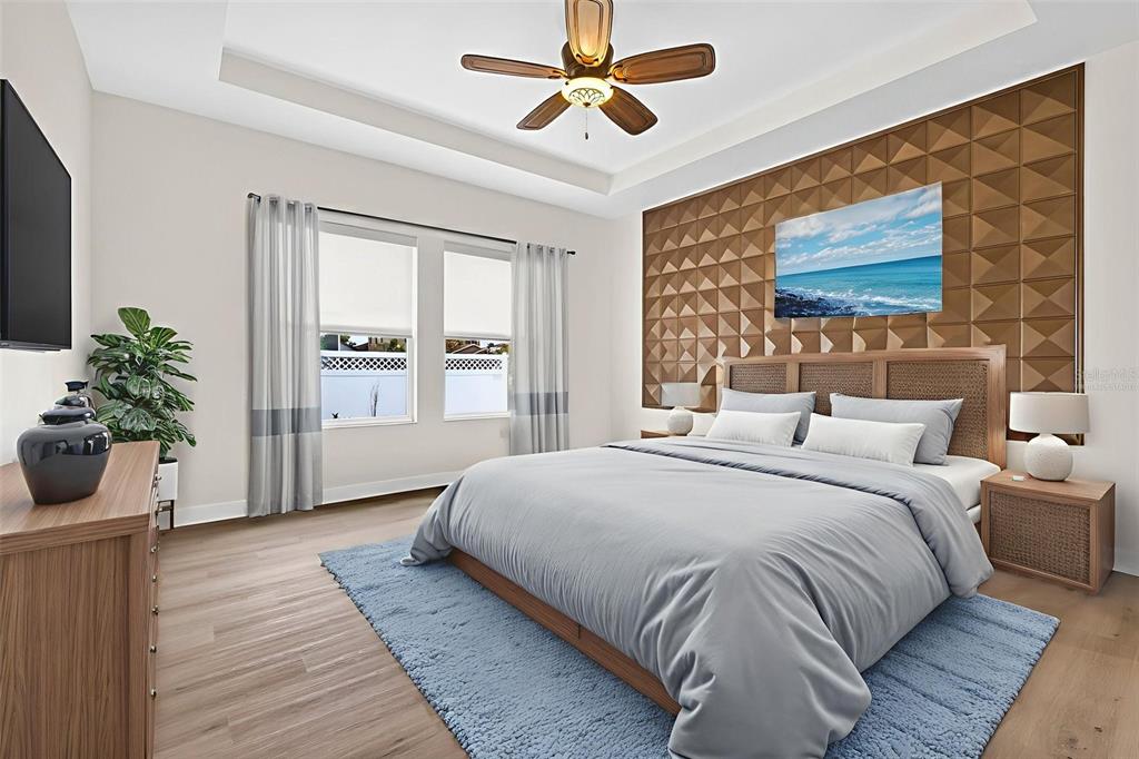 33487 Azalea Ridge Drive Wesley Chapel, FL 33545 - Photo 32 of 56 a spacious bedroom with a bed and a chandelier