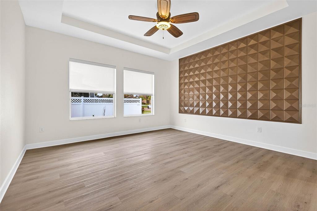 33487 Azalea Ridge Drive Wesley Chapel, FL 33545 - Photo 33 of 56 wooden floor in an empty room with a window