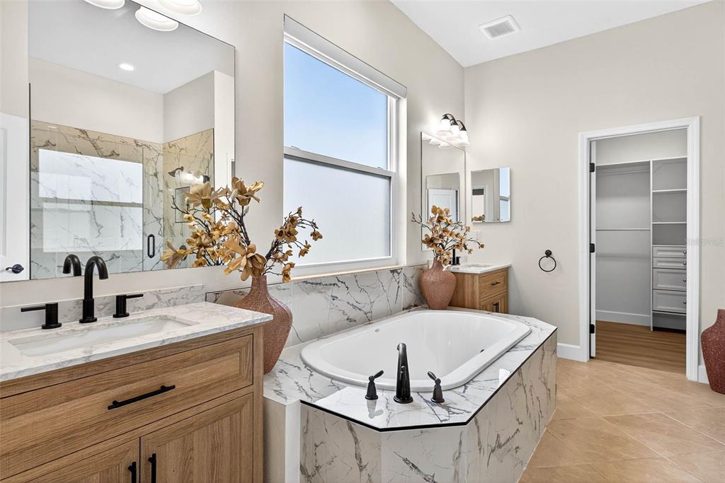 33487 Azalea Ridge Drive Wesley Chapel, FL 33545 - Photo 36 of 56 a living room with furniture and chandelier