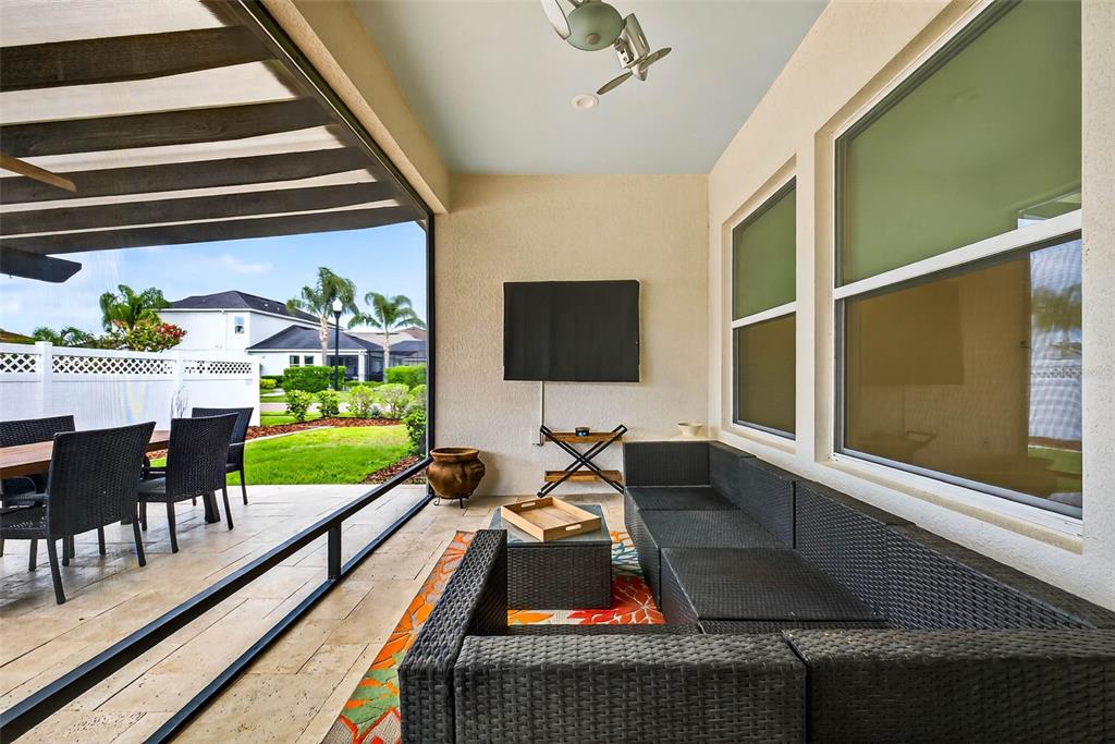 33487 Azalea Ridge Drive Wesley Chapel, FL 33545 - Photo 40 of 56 a living room with furniture and a flat screen tv