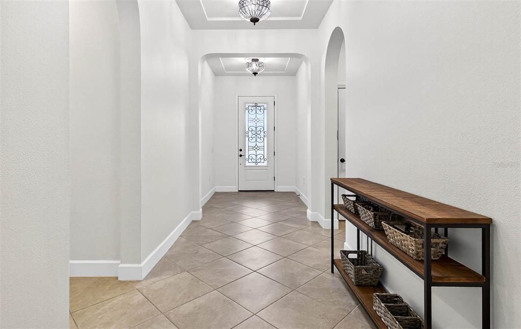 33487 Azalea Ridge Drive Wesley Chapel, FL 33545 - Photo 7 of 56 a view of a hallway with entryway