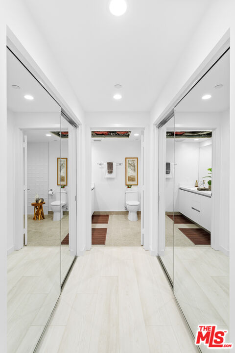 11620 Chenault Street, Unit 304 Los Angeles, CA 90049 - Photo 12 of 19 a spacious bedroom with a large bed and dresser