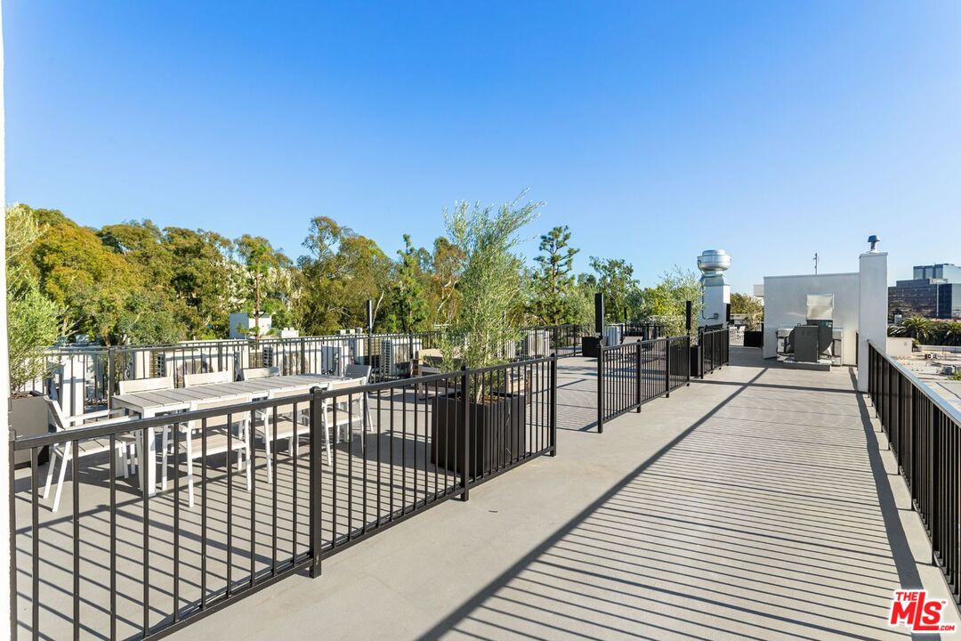 11620 Chenault Street, Unit 304 Los Angeles, CA 90049 - Photo 16 of 19 a view of a balcony with city view