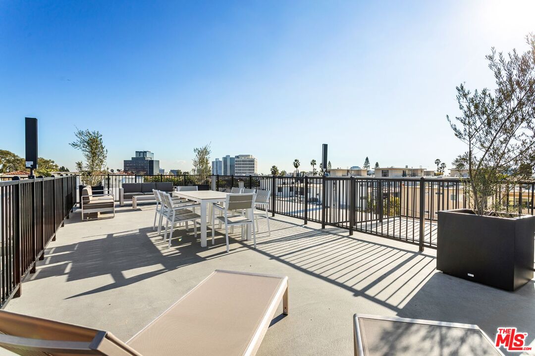 11620 Chenault Street, Unit 304 Los Angeles, CA 90049 - Photo 19 of 19 a view of a terrace with chairs