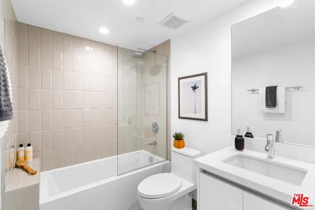 a bathroom with a sink toilet and bathtub