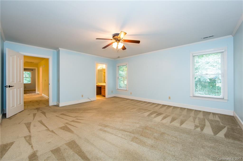 1210 Guildcrest Lane Charlotte, NC 28213 - Photo 14 of 24 a view of a room with a ceiling fan and a window