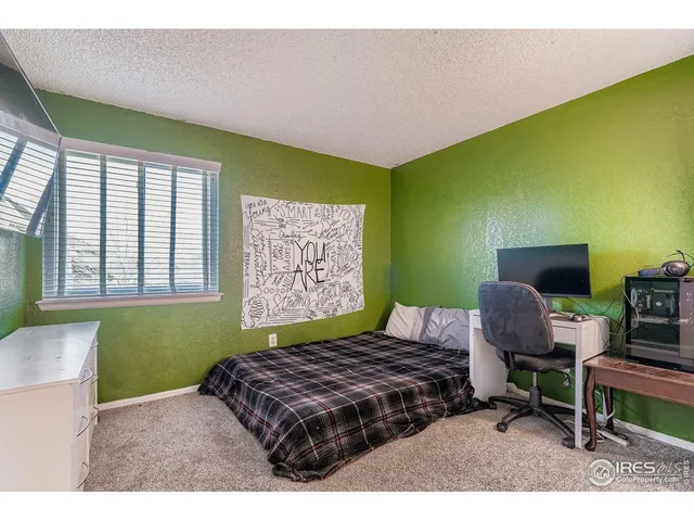 a bathroom with a granite countertop sink toilet a large mirror a shower and a bathtub