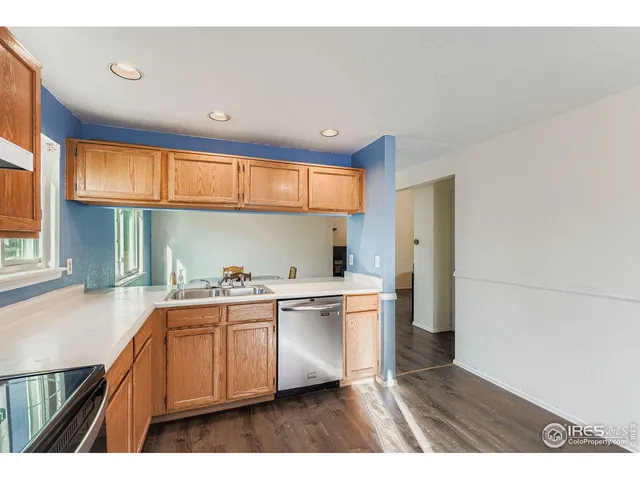 a kitchen with a sink cabinets and window