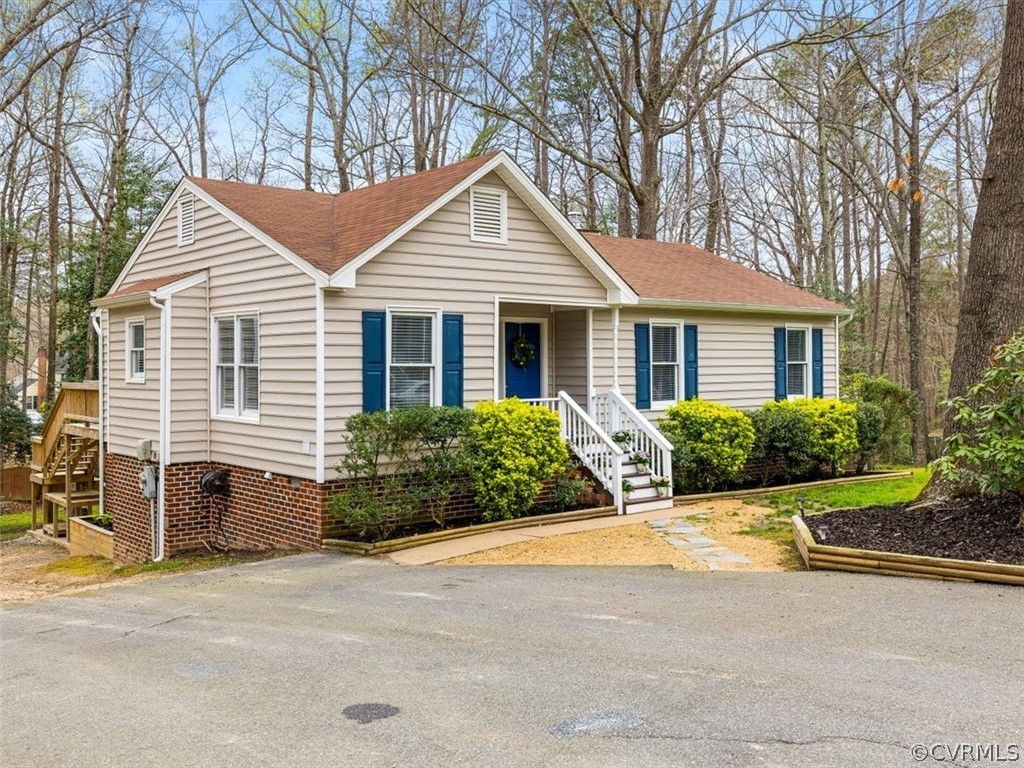 4408 Rabbit Foot Court Chesterfield, VA 23236 - Photo 2 of 36 a front view of a house with a yard