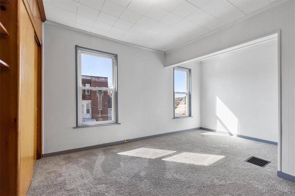 405 Walter Street Pittsburgh, PA 15210 - Photo 18 of 40 an empty room with windows and closet