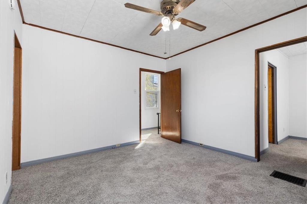 405 Walter Street Pittsburgh, PA 15210 - Photo 20 of 40 a view of an empty room with a chandelier fan