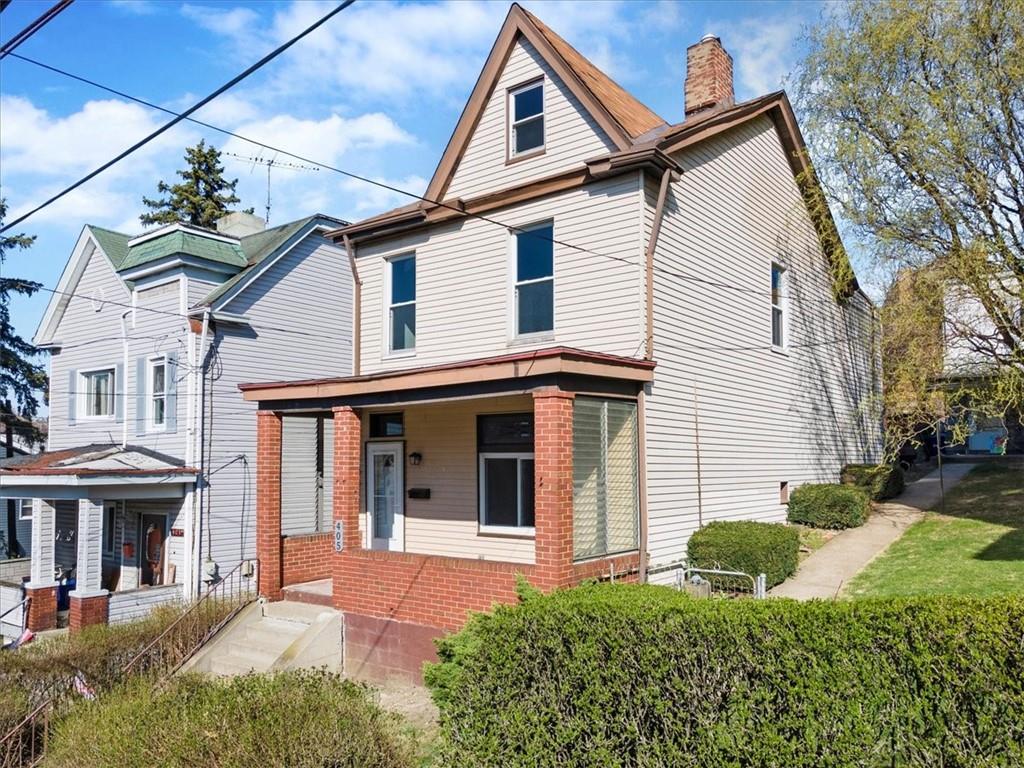 405 Walter Street Pittsburgh, PA 15210 - Photo 2 of 40 a front view of a house with a yard
