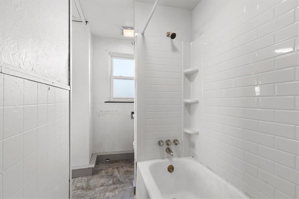 405 Walter Street Pittsburgh, PA 15210 - Photo 24 of 40 a bathroom with a bathtub and shower