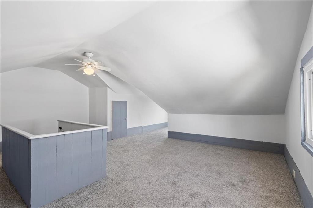 405 Walter Street Pittsburgh, PA 15210 - Photo 26 of 40 a view of an empty room with a chandelier
