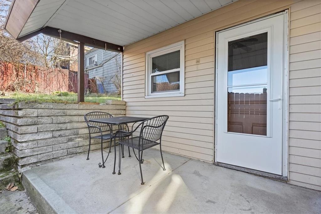 405 Walter Street Pittsburgh, PA 15210 - Photo 29 of 40 a patio with table and chairs and potted plants