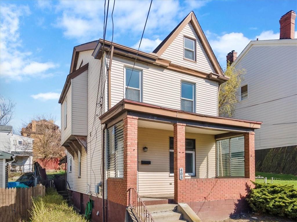 405 Walter Street Pittsburgh, PA 15210 - Photo 35 of 40 a view of a house with a potted plant and stairs