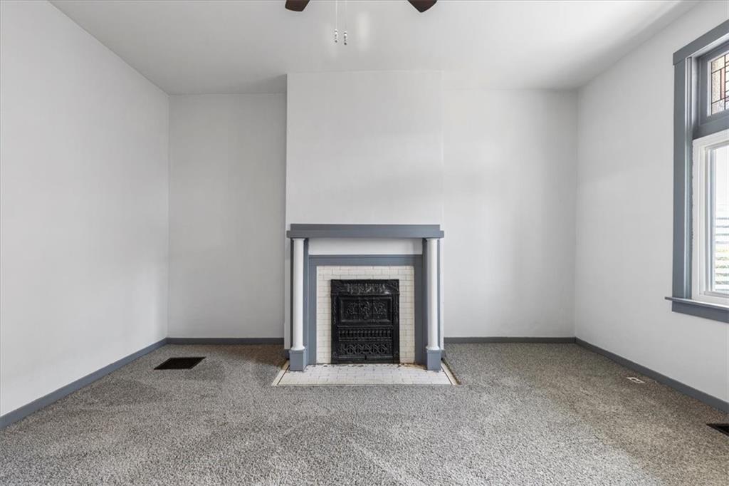 405 Walter Street Pittsburgh, PA 15210 - Photo 5 of 40 a view of an empty room with a fireplace