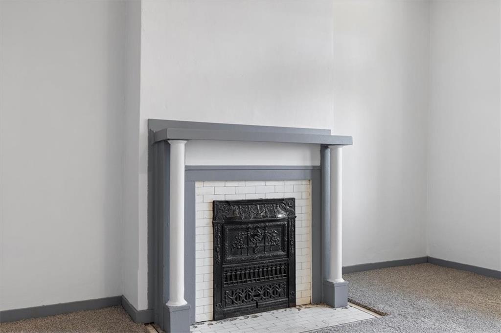 405 Walter Street Pittsburgh, PA 15210 - Photo 7 of 40 a room with a fireplace