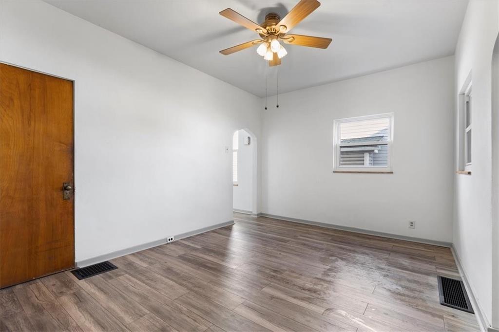 405 Walter Street Pittsburgh, PA 15210 - Photo 9 of 40 a view of empty room with wooden floor and fan