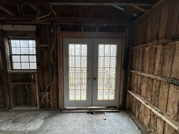 a view of an empty room with a window