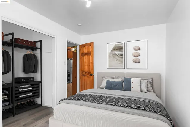 a bedroom with a bed and a television