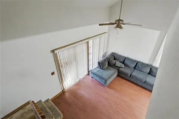 a living room with furniture and a rug