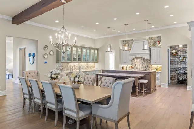 a kitchen with granite countertop a sink stove and cabinets
