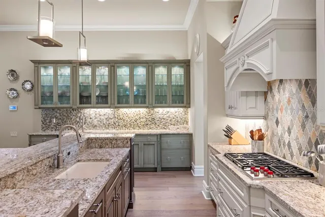 a view of a dining room with furniture wooden floor and chandelier