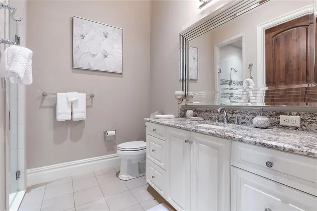 a kitchen with a stove top oven and refrigerator