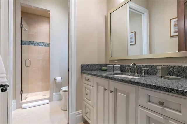 a bathroom with a sink double vanity and a mirror