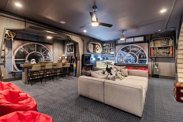 a view of a dining room with furniture and chandelier