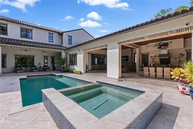 a view of a balcony with flower plants