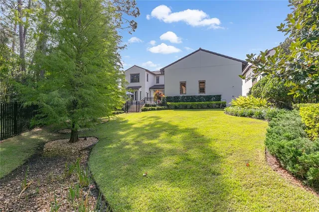 a front view of a building with a garden