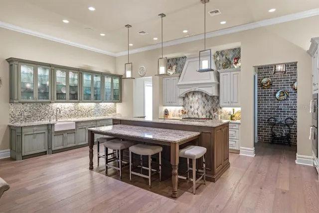 a dining table with chairs and wooden floor