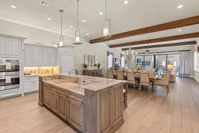 a kitchen with a sink and cabinets