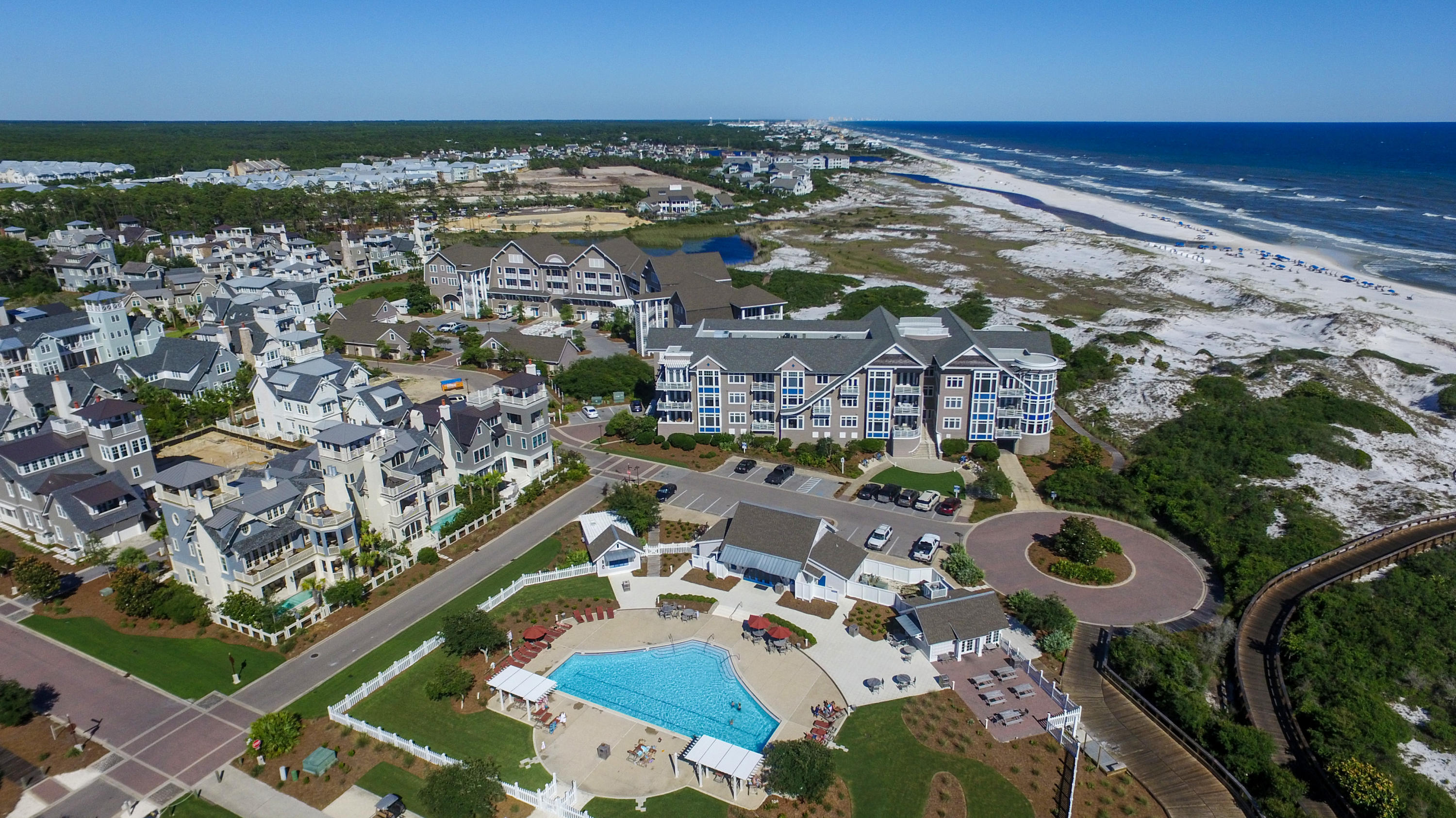 99 Compass Point Way South, Unit 201 Inlet Beach, FL 32461 - Photo 2 of 56 an aerial view of residential houses with outdoor space
