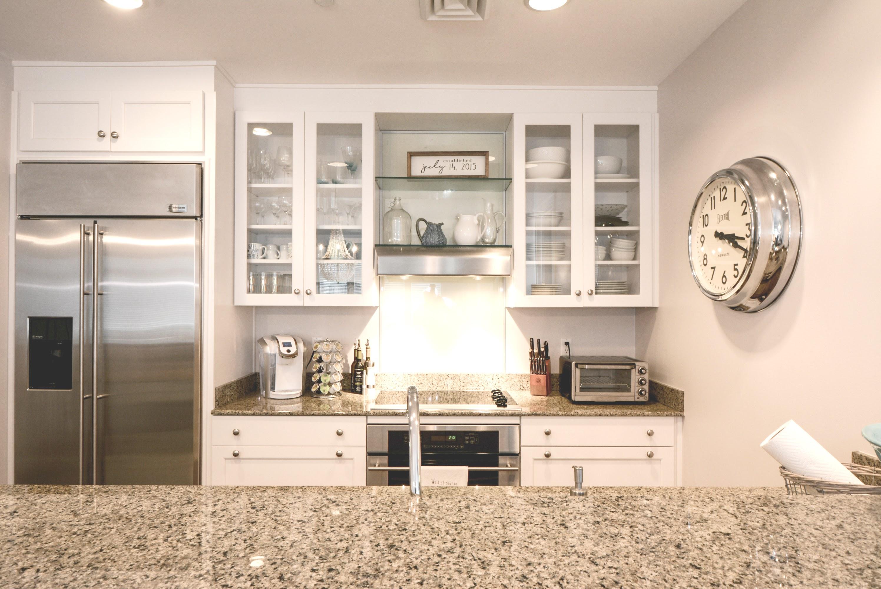 99 Compass Point Way South, Unit 201 Inlet Beach, FL 32461 - Photo 14 of 56 a kitchen with stainless steel appliances kitchen island granite countertop a refrigerator and a stove