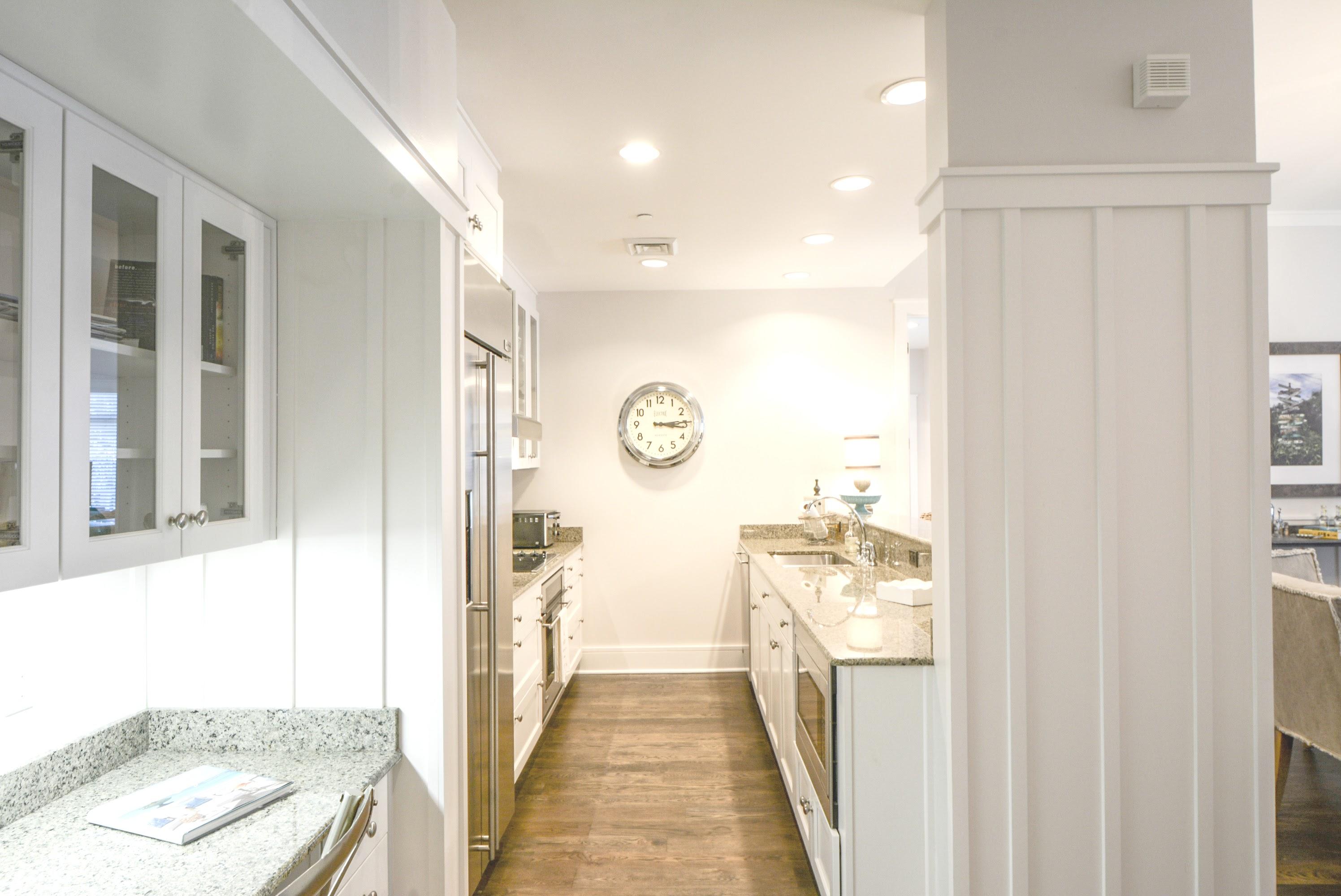 99 Compass Point Way South, Unit 201 Inlet Beach, FL 32461 - Photo 16 of 56 a hallway with white cabinets and wooden floor