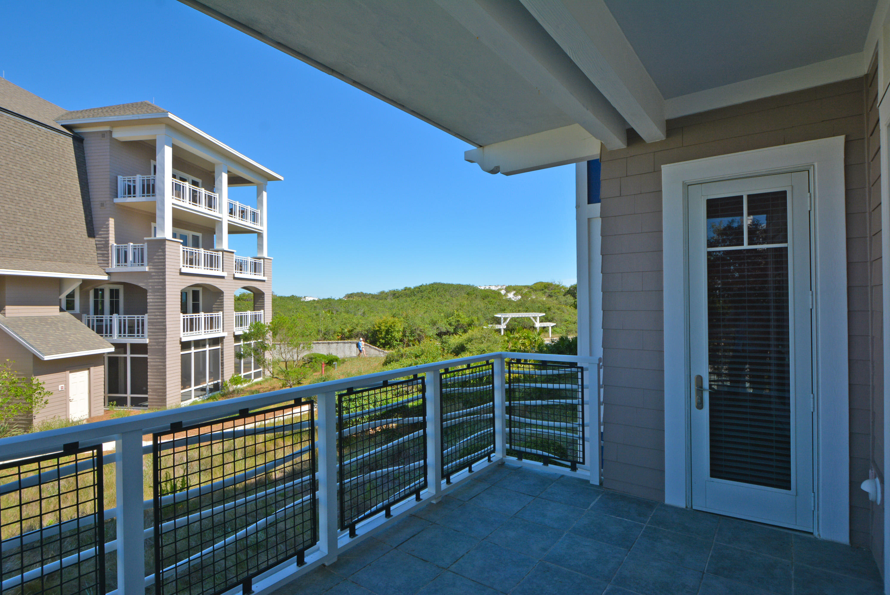 99 Compass Point Way South, Unit 201 Inlet Beach, FL 32461 - Photo 20 of 56 a view of a balcony with an outdoor space