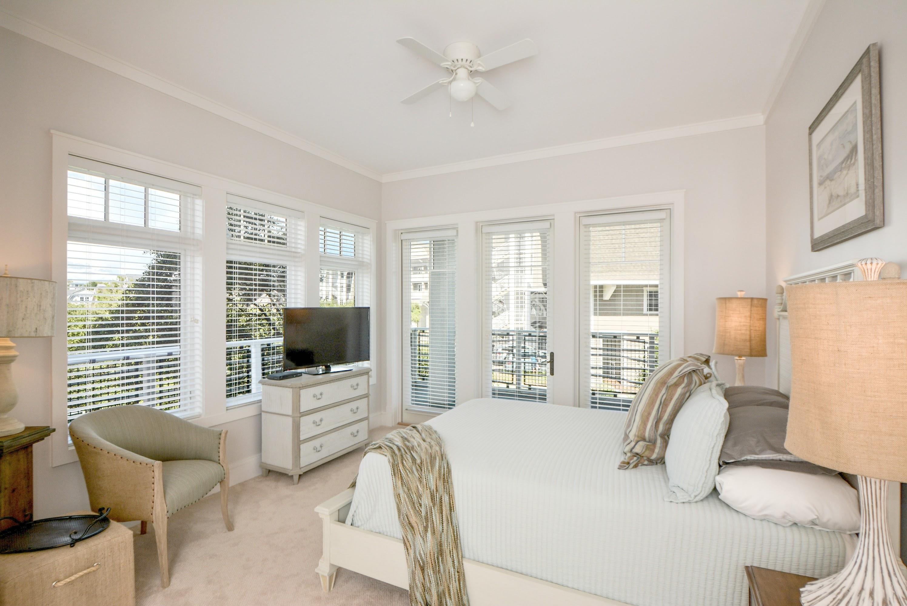 99 Compass Point Way South, Unit 201 Inlet Beach, FL 32461 - Photo 21 of 56 a bedroom with furniture and a flat screen tv