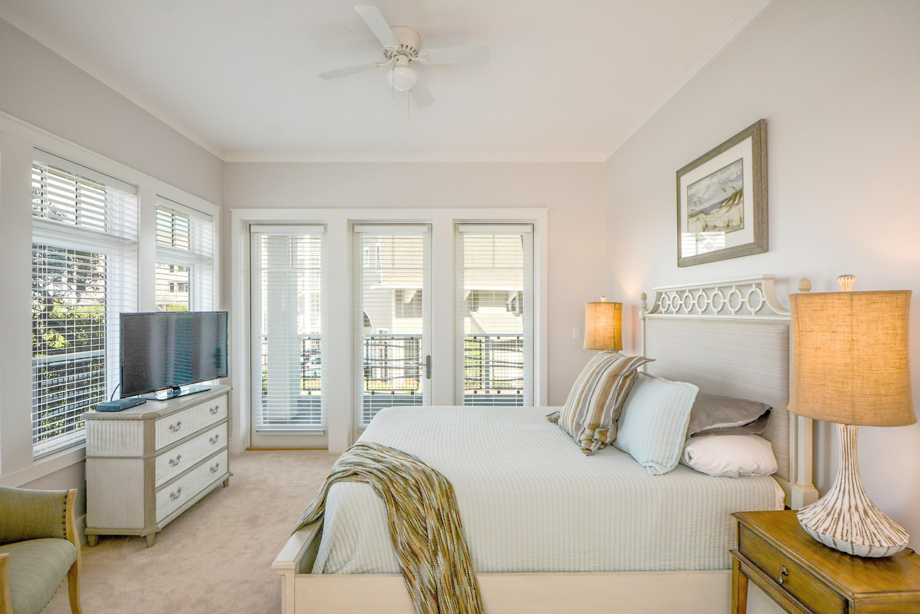 99 Compass Point Way South, Unit 201 Inlet Beach, FL 32461 - Photo 22 of 56 a bedroom with a bed and a flat tv screen