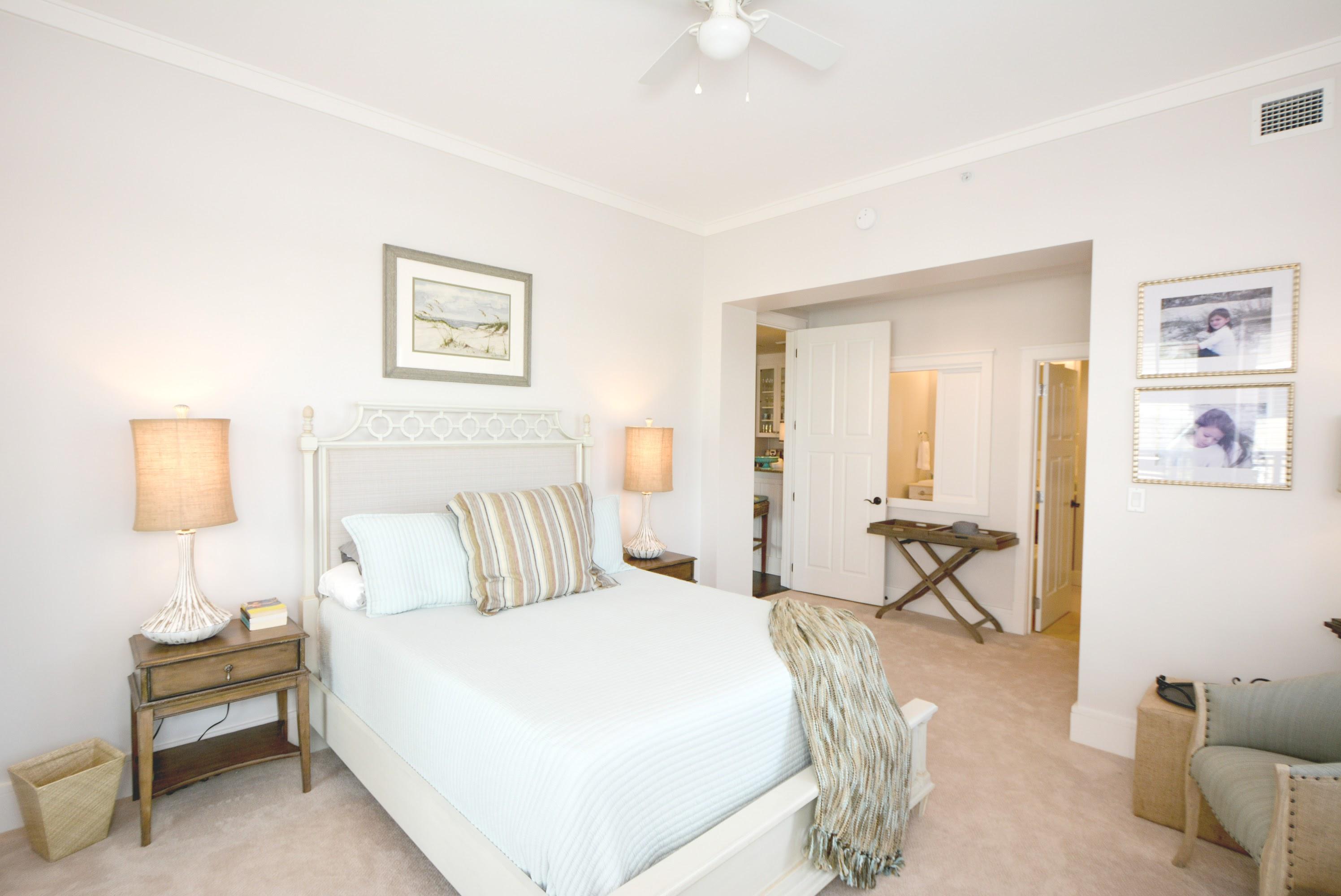 99 Compass Point Way South, Unit 201 Inlet Beach, FL 32461 - Photo 23 of 56 a bedroom with a bed and a chair