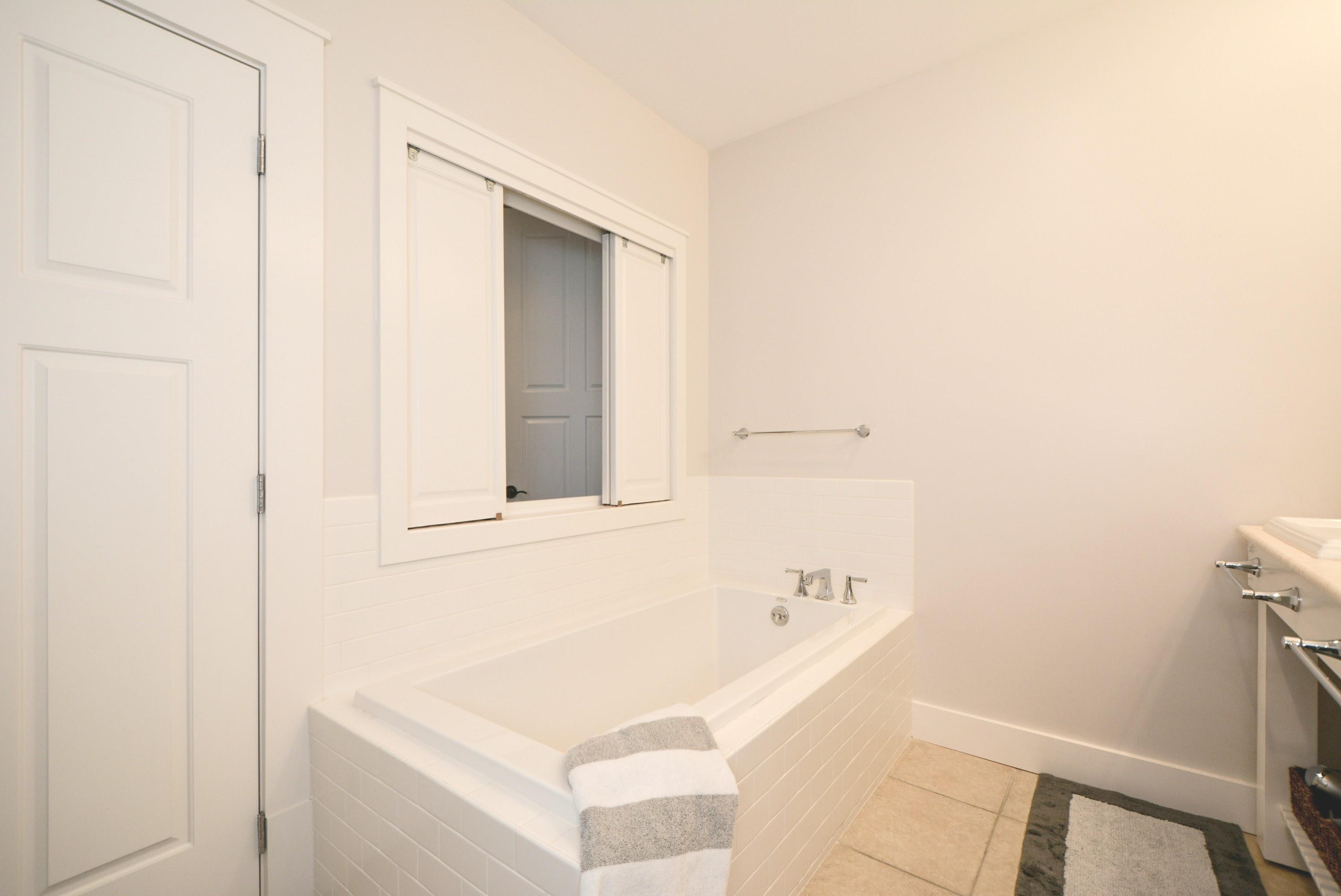 99 Compass Point Way South, Unit 201 Inlet Beach, FL 32461 - Photo 29 of 56 a bathroom with a tub sink and vanity