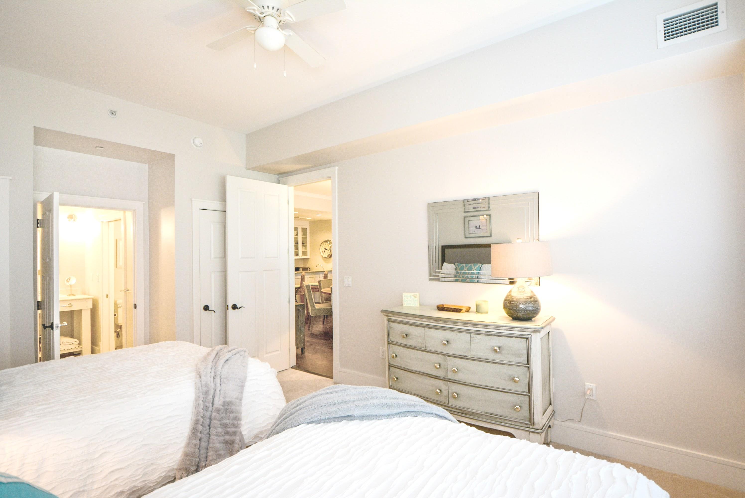 99 Compass Point Way South, Unit 201 Inlet Beach, FL 32461 - Photo 32 of 56 a bedroom with a bed and a dresser