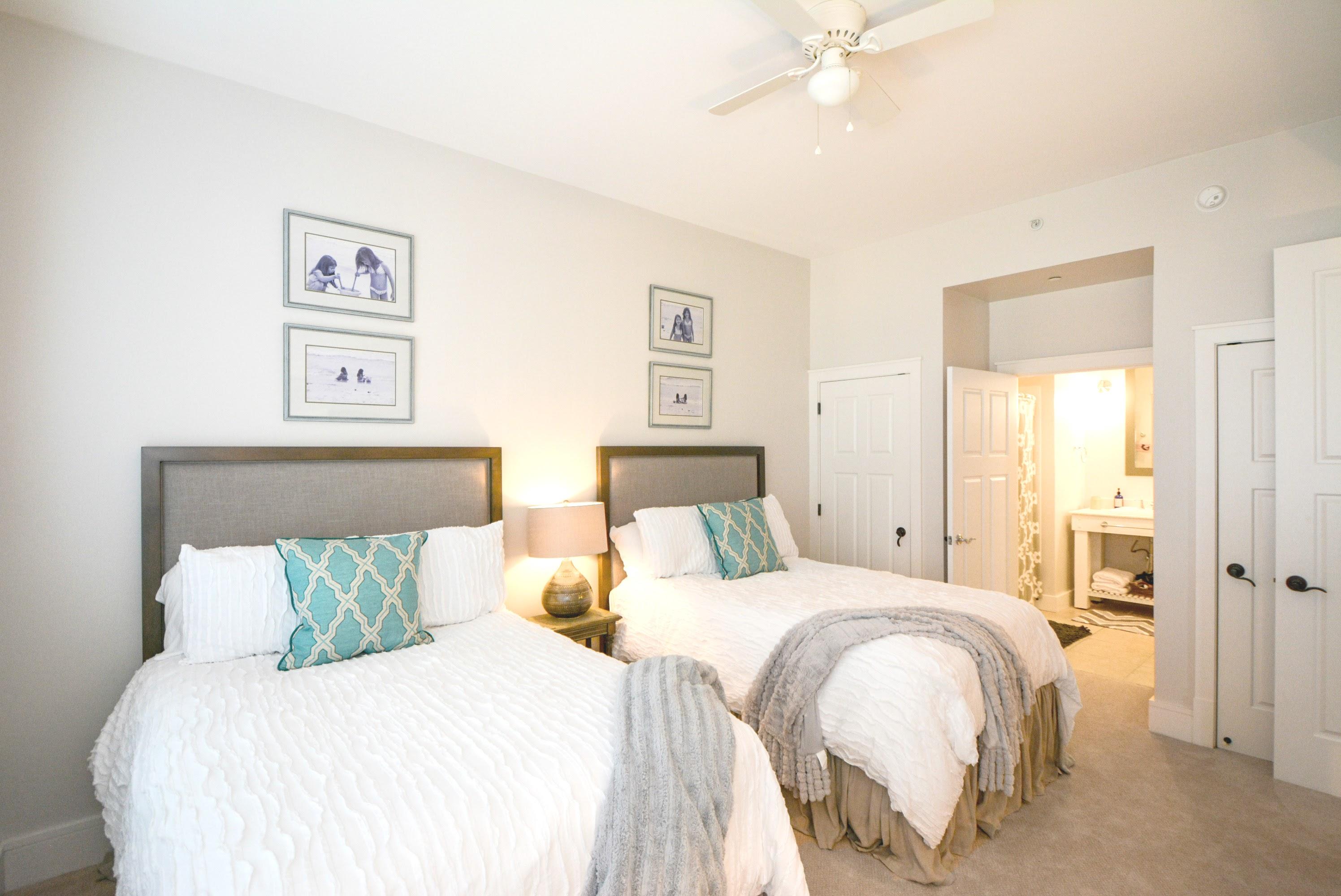 99 Compass Point Way South, Unit 201 Inlet Beach, FL 32461 - Photo 33 of 56 a bedroom with a bed and a painting on the wall