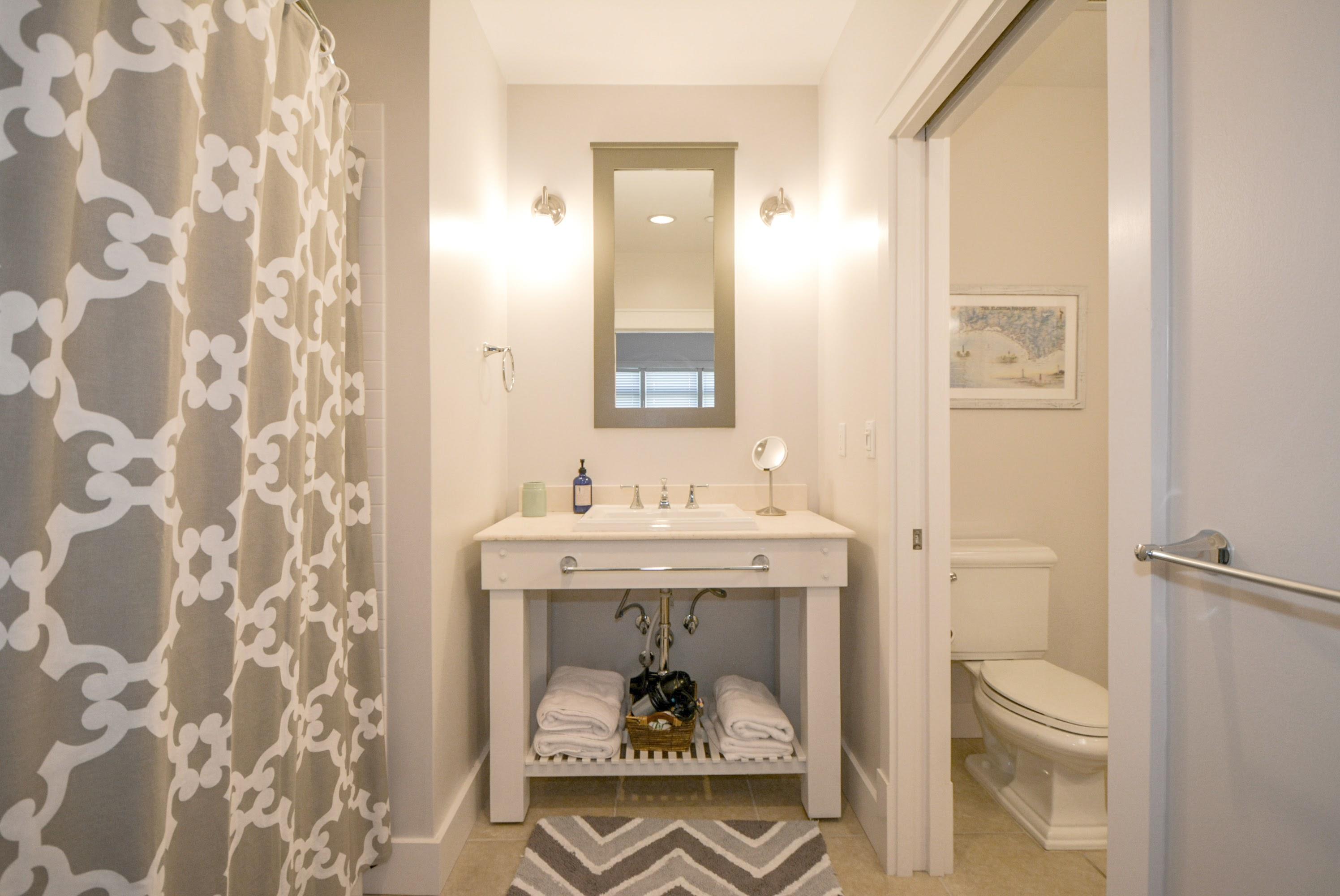 99 Compass Point Way South, Unit 201 Inlet Beach, FL 32461 - Photo 34 of 56 a view of bathroom with a toilet sink and mirror