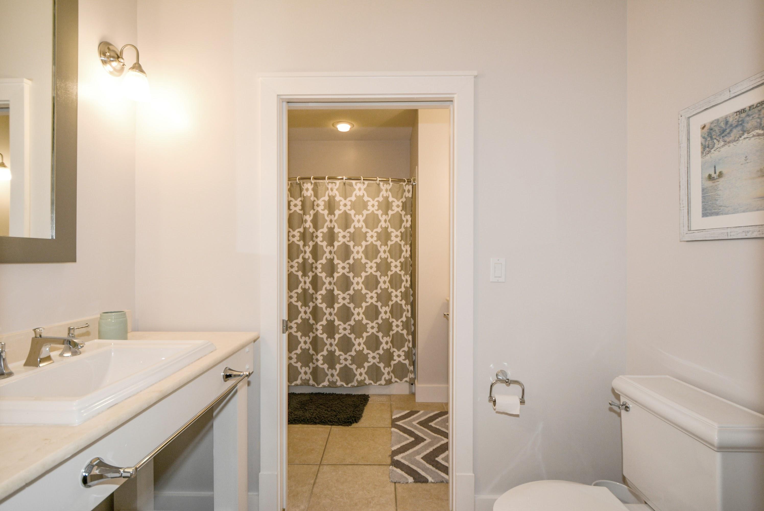 99 Compass Point Way South, Unit 201 Inlet Beach, FL 32461 - Photo 35 of 56 a bathroom with a sink toilet and shower