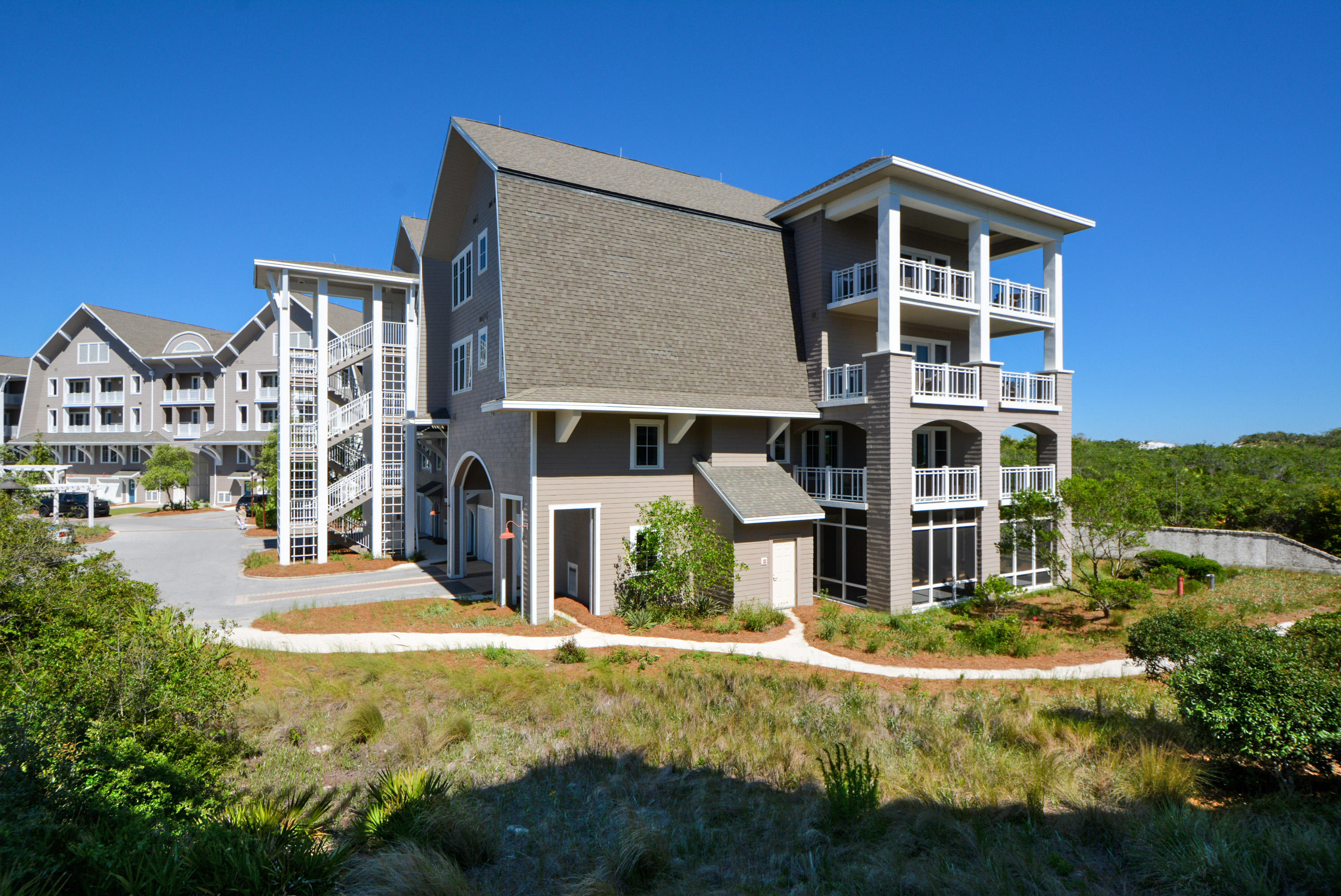 99 Compass Point Way South, Unit 201 Inlet Beach, FL 32461 - Photo 39 of 56 a front view of a house with a yard