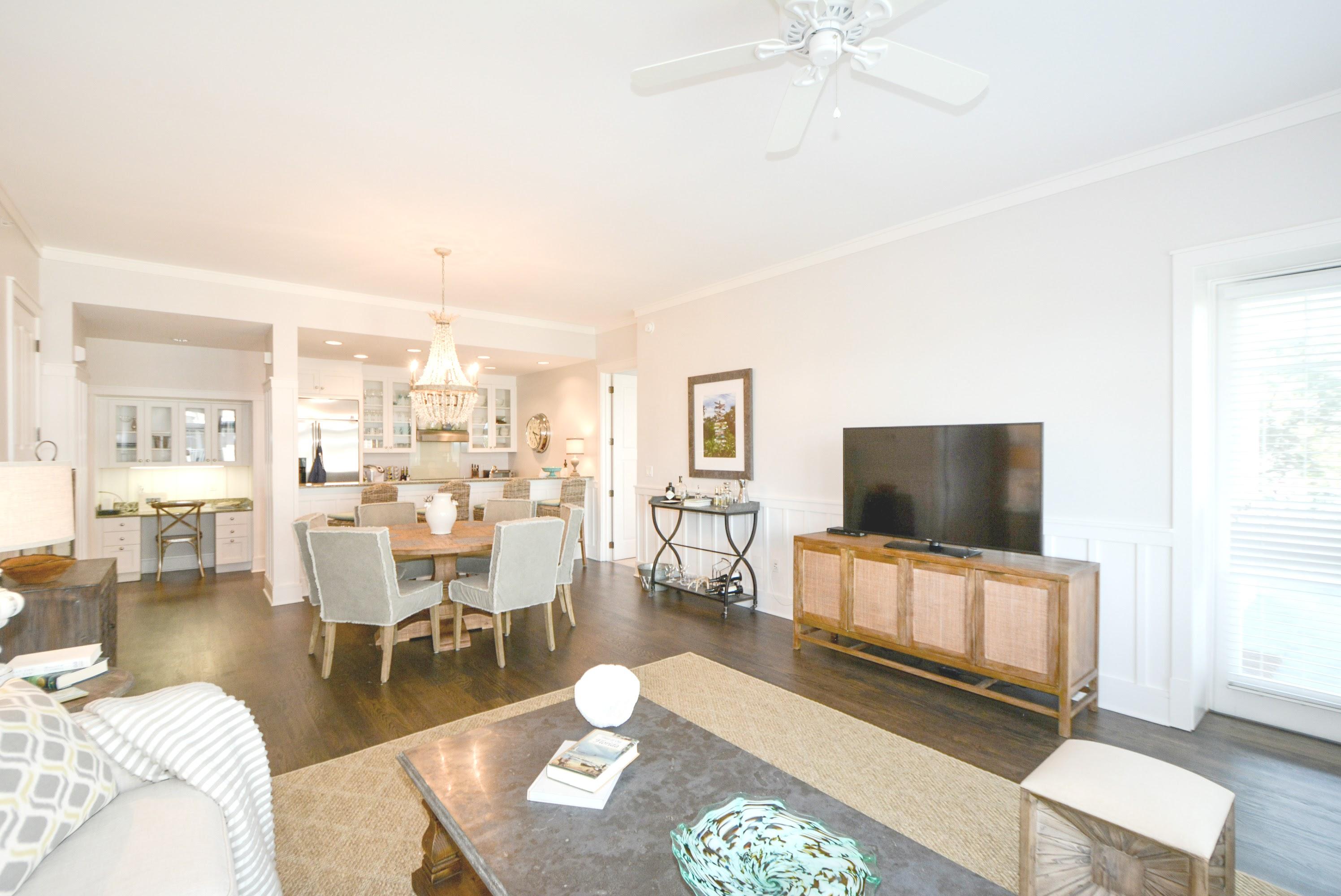 99 Compass Point Way South, Unit 201 Inlet Beach, FL 32461 - Photo 5 of 56 a living room with furniture and a flat screen tv
