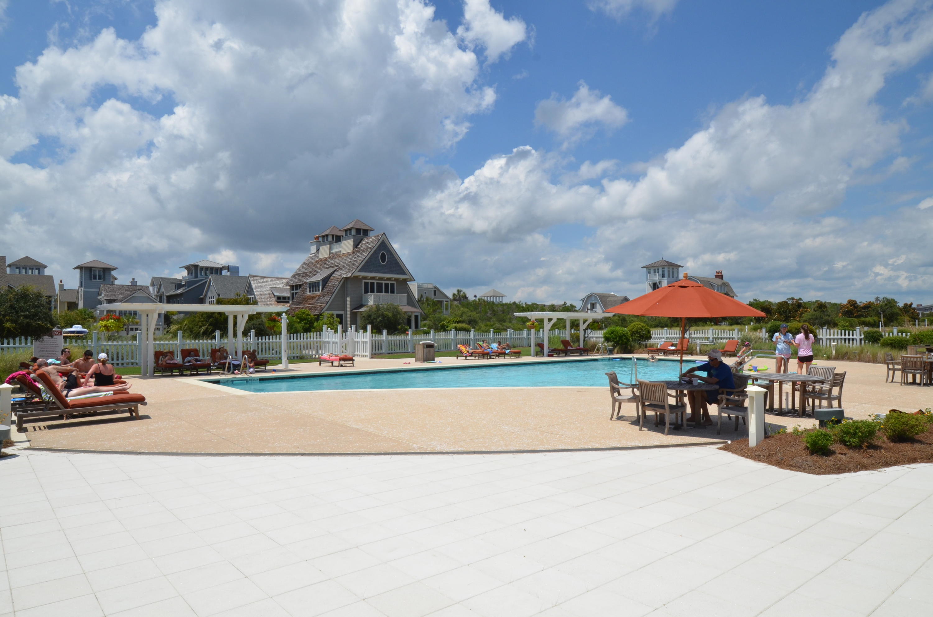 99 Compass Point Way South, Unit 201 Inlet Beach, FL 32461 - Photo 50 of 56 an outdoor space with patio and white umbrellas
